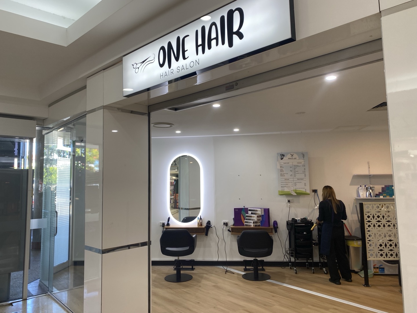 Woman with styled hair in a bright salon